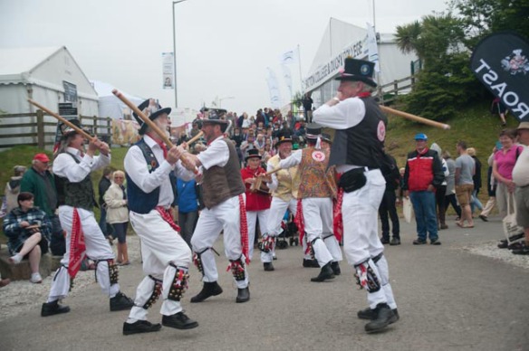 Semi-relevant photo: What's more English than morris dancing? I like this shot because the guy on the right looks like he's about to brain the guy on the left. Photo by Ida Swearingen.