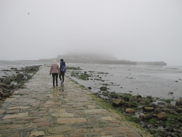 Irrelevant photo: The causeway to St. Michael's Mount, emerging as the tide drops. There's a castle out there, hidden in the fog. 